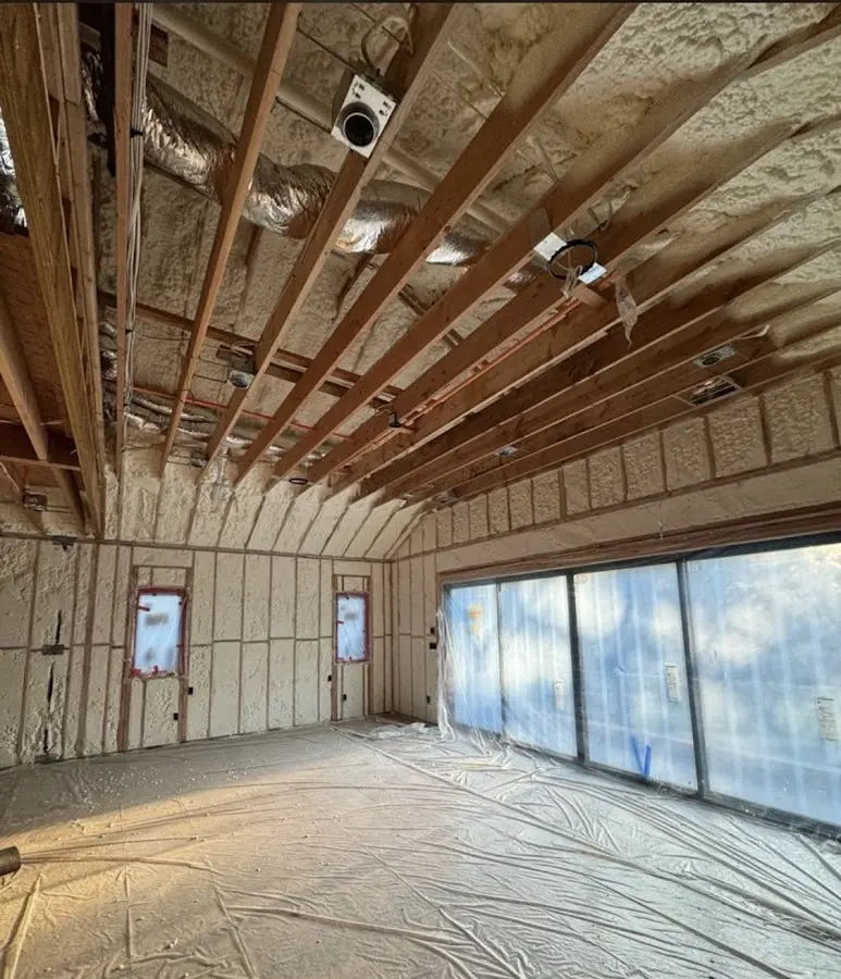 Interior walls and ceiling insulated with spray foam during new construction in Rio Pinar
